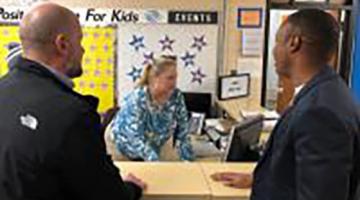 Two people at the front desk of Flint Boys and Girls Club